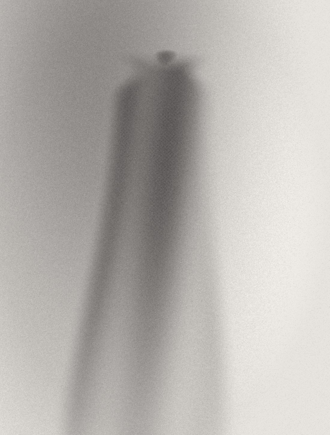 Pressed wool coat falling in a single line